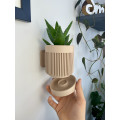 Wall planter with hidden mounting and drainage